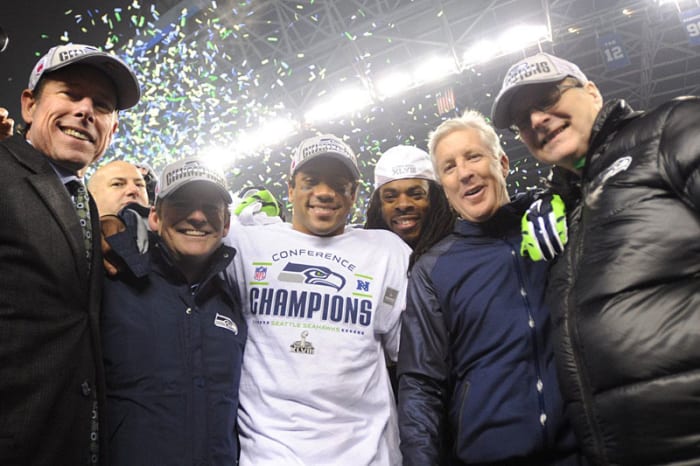 The Seattle brain trust: president Peter McLoughlin, GM John Schneider, QB Russell Wilson, cornerback Richard Sherman, coach Pete Carroll and owner Paul Allen. (Rod Mar for SI/The MMQB)